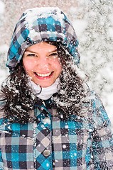 Image showing Out of focus picture of a woman with a lot of snowflakes