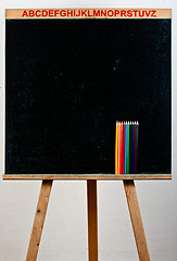 Image showing Black chalkboard with pencils