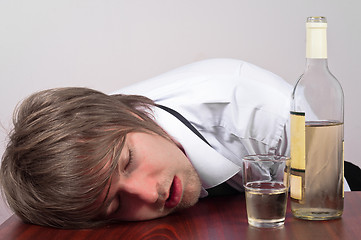 Image showing Young man with alcohol