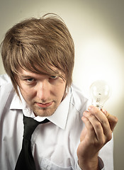 Image showing Handsome man and light bulb