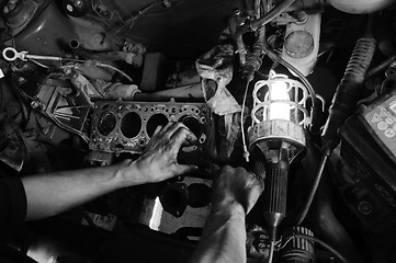 Image showing Hands of a worker repairing car