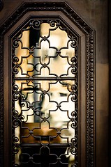 Image showing Old window with reflection and steel cage