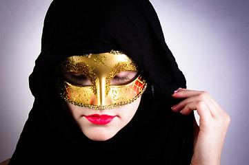 Image showing Closeup photo of a woman in black hood and red lips