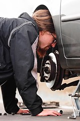 Image showing Young man in the middle of a car repair