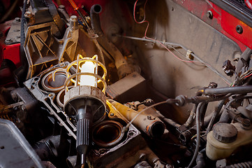 Image showing Industrial lamp on old motor block