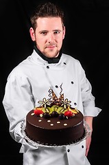 Image showing Handsome chef with cake