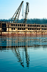 Image showing Damaged industrial boat in the dock