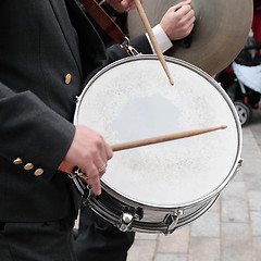 Image showing By tapping the drum