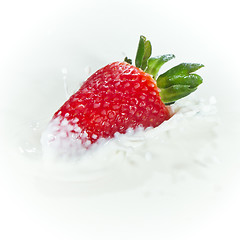 Image showing strawberry splashing into milk