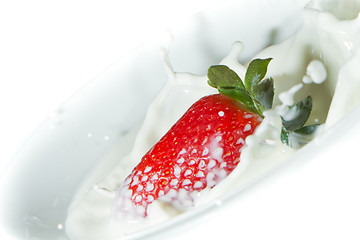 Image showing strawberry splashing into milk