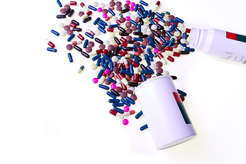 Image showing pills spilling out of container 