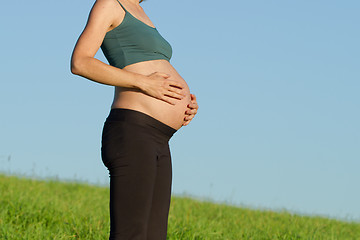 Image showing pregnant woman on meadow