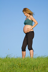 Image showing pregnant woman on meadow