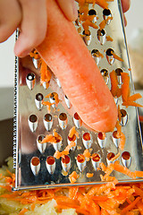 Image showing chef grating carrot