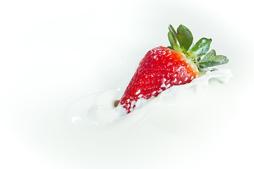 Image showing strawberry splashing into milk