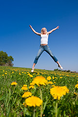 Image showing happy young woman on meadow