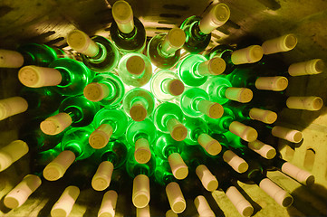 Image showing wine bottles stacked up