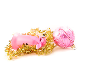 Image showing golden tinsel with pink glass decoration