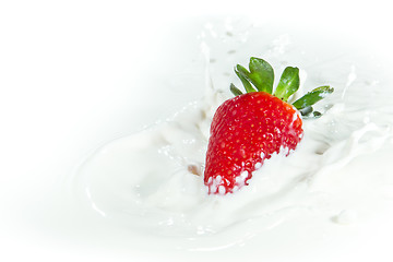 Image showing strawberry splashing into milk