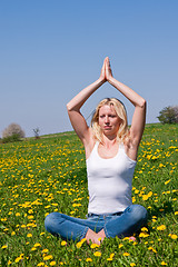 Image showing young woman exercising yoga