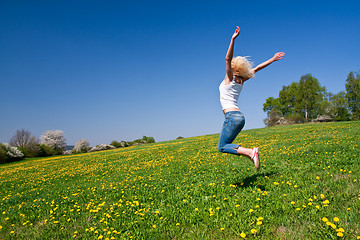 Image showing happy young woman on meadow