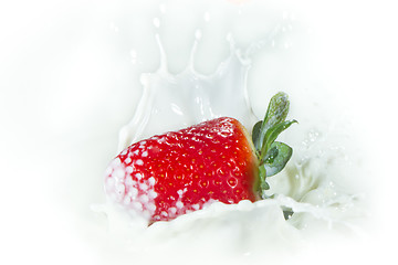 Image showing strawberry splashing into milk