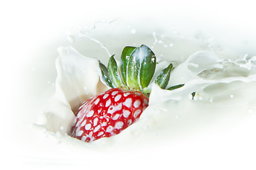 Image showing strawberry splashing into milk