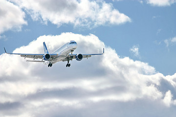 Image showing Modern airplane in the sky near airport. 
