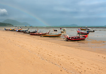 Image showing ebb of the sea a boat on the rocks