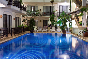 Image showing pool with blue water in a cozy hotel