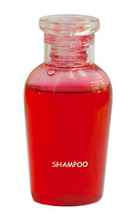 Image showing Small red bottle of shampoo