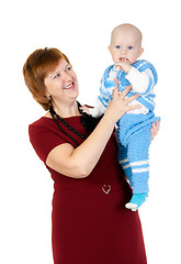 Image showing grandmother with her grandson in her arms in the studio