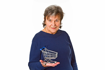 Image showing Female senior holding empty model shopping trolley