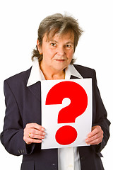 Image showing Female senior holding question mark