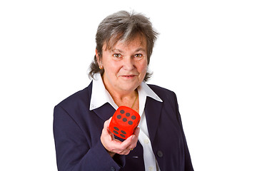 Image showing Female senior showing dice
