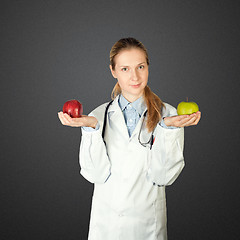 Image showing female doctor with two apples