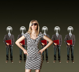 Image showing woman and lamp head businesspeople with laptop