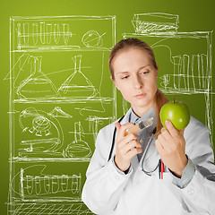 Image showing scientist woman with apple