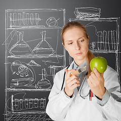 Image showing scientist woman with apple