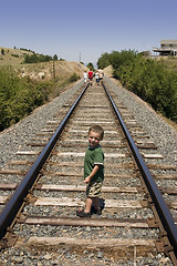 Image showing Little Boy on the Train Tracks