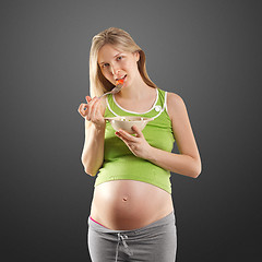 Image showing tender pregnant female with salad