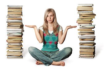 Image showing woman in lotus pose with many books near