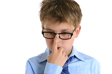 Image showing Child pushing glasses up onto nose