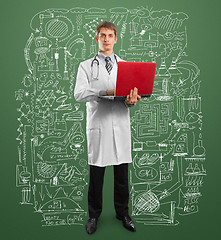 Image showing doctor male in suit with laptop in his hands