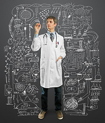 Image showing Doctor male writing something 