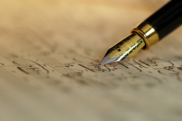 Image showing Sheet music and fountain pen