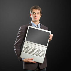 Image showing businessman with open laptop in his hands