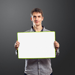 Image showing male with write board in his hands