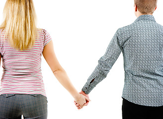 Image showing A young couple holding each other's hands