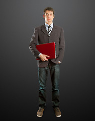 Image showing male in suit with laptop in his hands